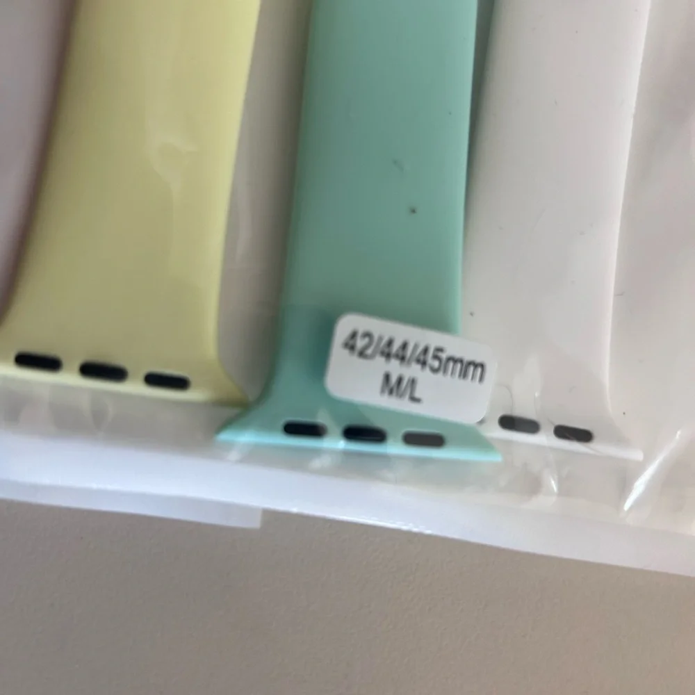 Pink Apple Wearable Bands Blue, Yellow are unknown Brands. 42/44/45 mm watch.